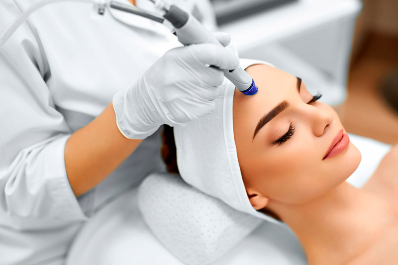woman undergoing one of the best skin rejuvenation procedures, microdermabrasion